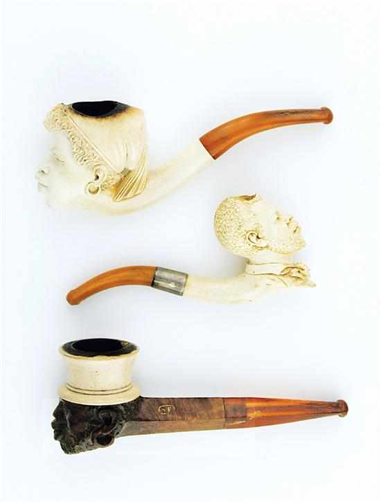 Appraisal: Meerschaum Nubian caricature pipes with cases th century carved figure