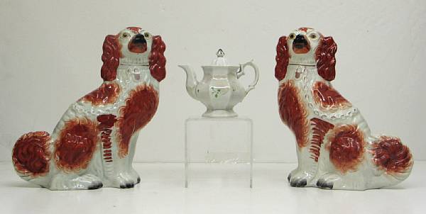 Appraisal: A pair of Staffordshire pottery spaniels and teapot th century