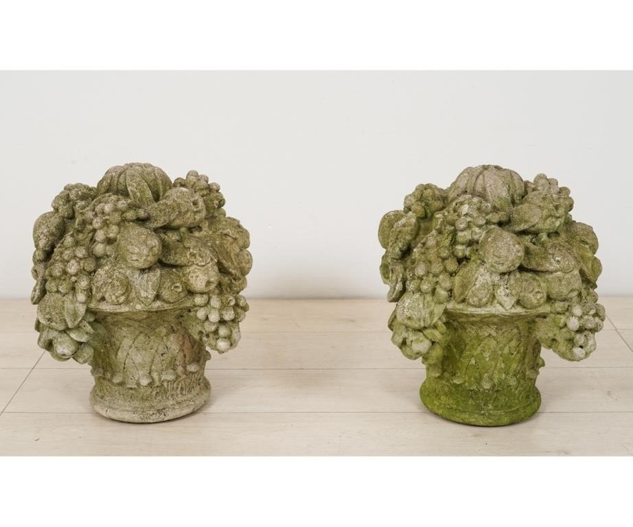 Appraisal: Large pair of cast stone garden baskets of flowers Both