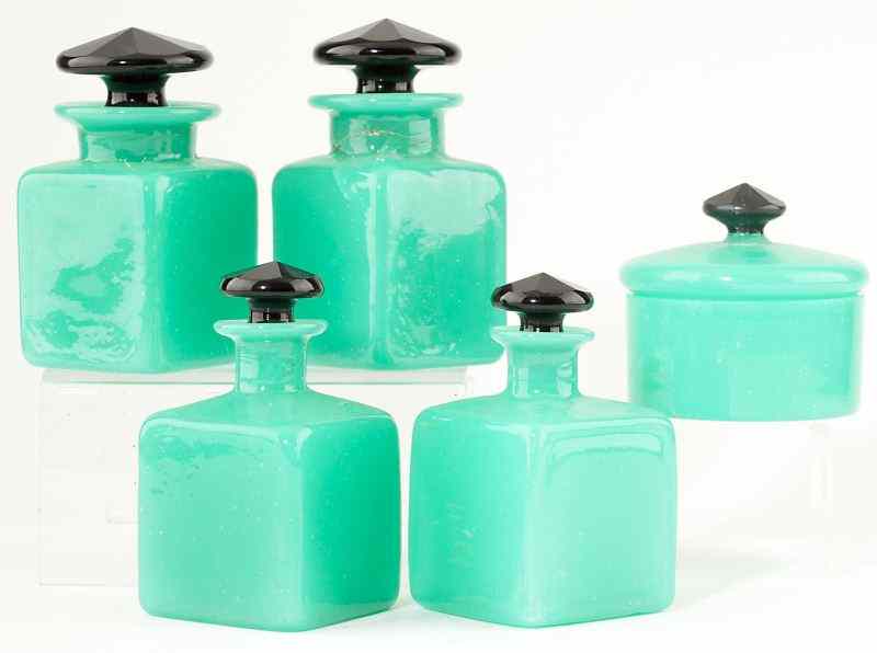 Appraisal: Art Deco Jadeite Dresser Setcirca s including four bottles and