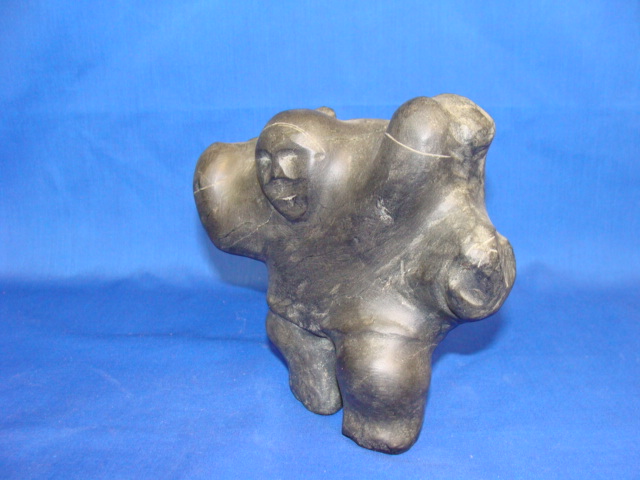 Appraisal: BARNABUS ARNASUUNGAAAQ Inuit th century Hunter Carrying Musk Ox H