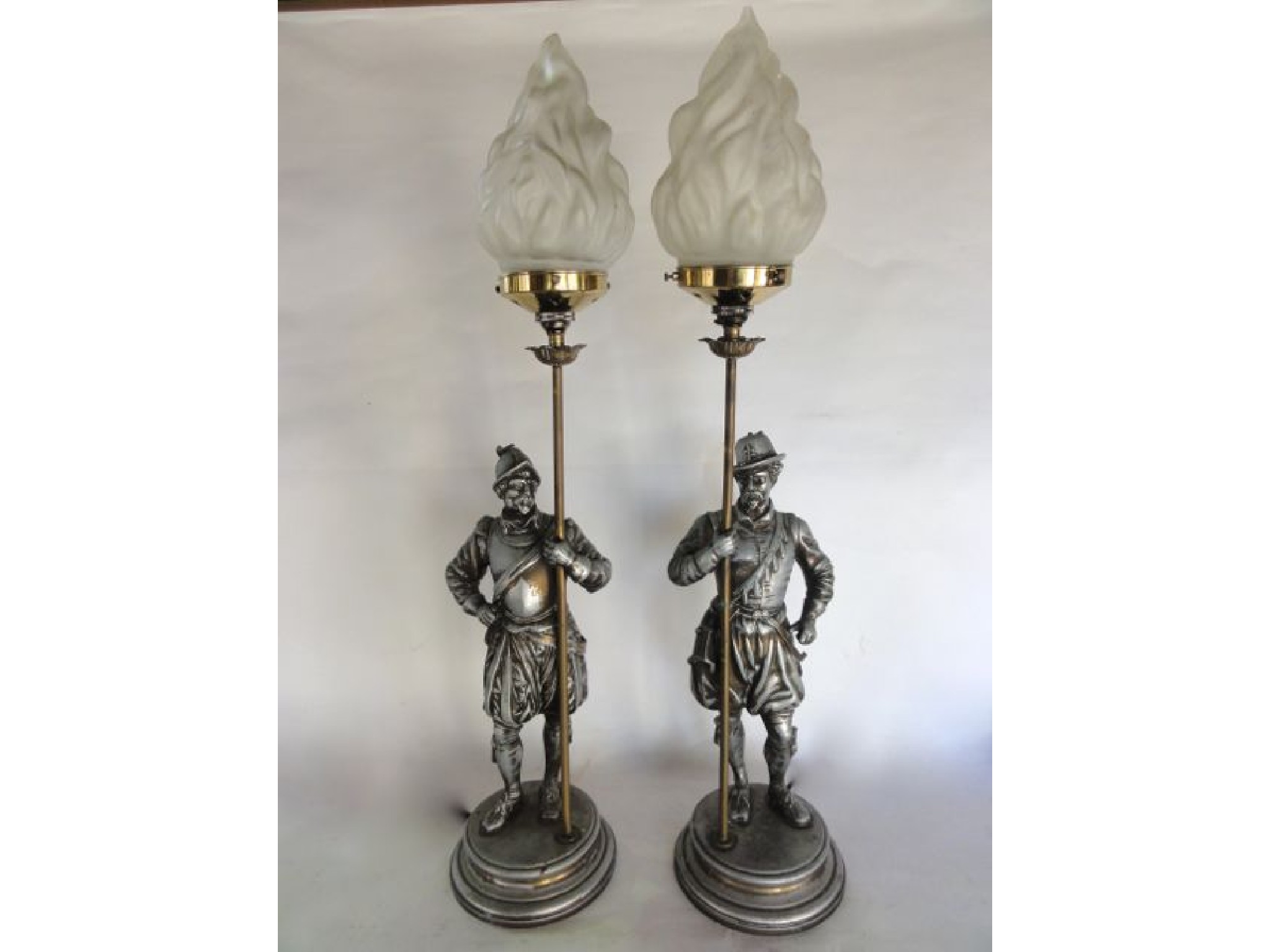 Appraisal: A pair of electronic cast metal table lamps each in