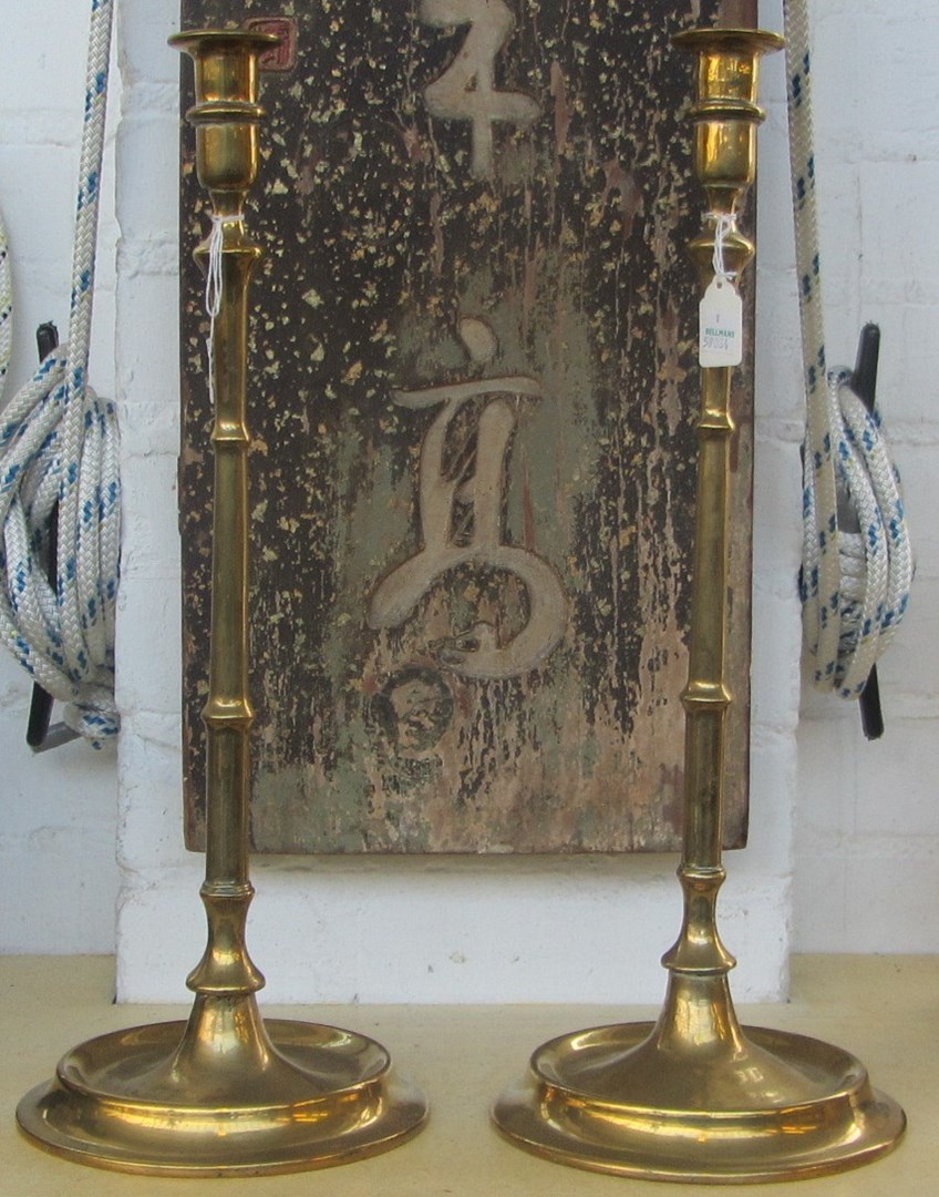 Appraisal: A pair of brass spun candlesticks early th century with