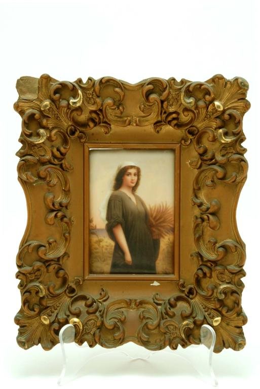 Appraisal: Painted porcelain plaque of a young woman carrying a basket