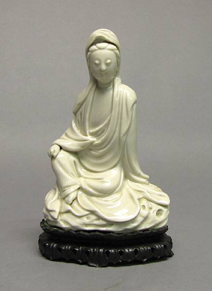 Appraisal: A Dehua porcelain figure of a seated Guanyin th Century