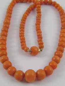 Appraisal: A graduated coral bead necklace the largest measuring approx mm