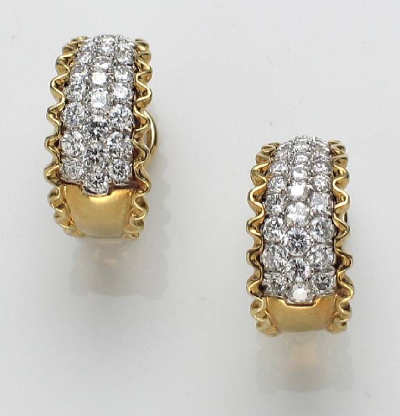 Appraisal: A pair of diamond clip-earrings estimated total diamond weight for