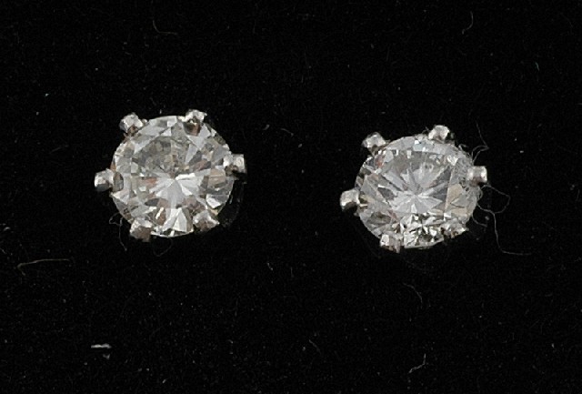 Appraisal: A pair of diamond stud earrings Each set with a