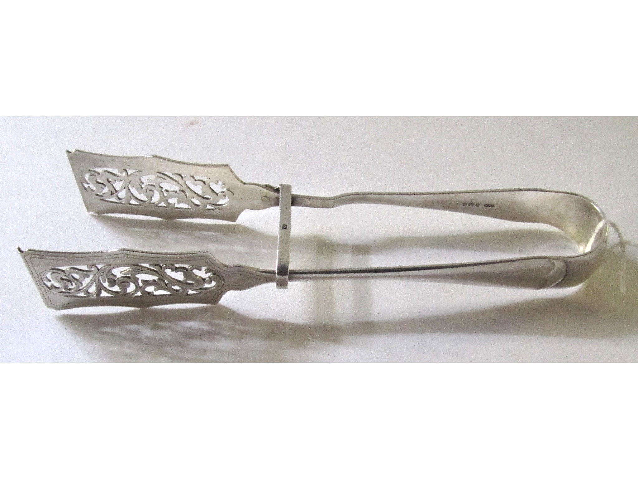 Appraisal: A pair of silver asparagus tongs Sheffield oz