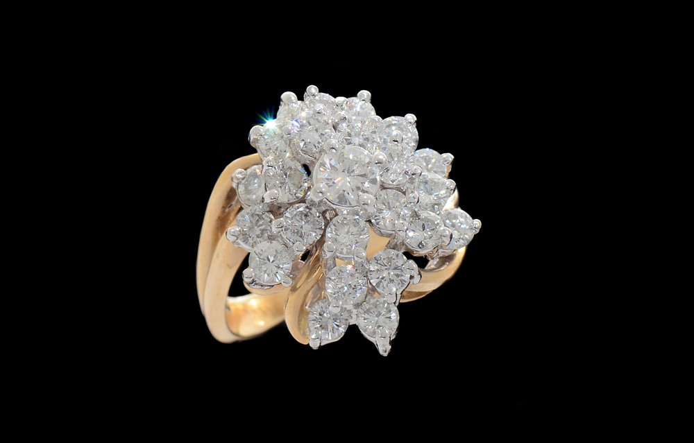 Appraisal: DIAMOND PRINCESS RING K yellow gold ring at the center