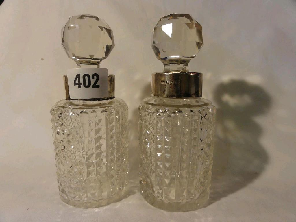 Appraisal: A pair of glass perfume bottles of cylindrical form with