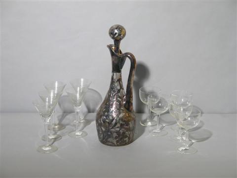 Appraisal: SILVER OVERLAY DECANTER Of elongated form with a plain handle