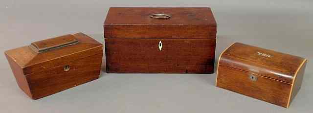 Appraisal: Three English mahogany tea caddies th c the largest with