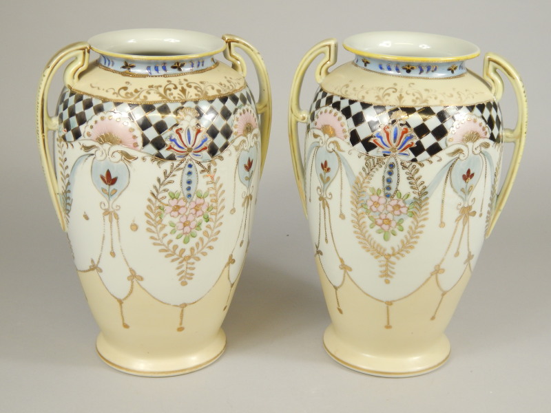 Appraisal: A pair of Japanese porcelain two handled vases each with