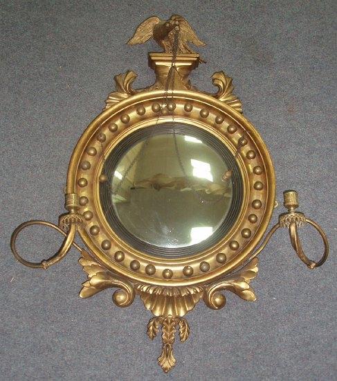 Appraisal: A Regency style convex mirror the circular glass to a