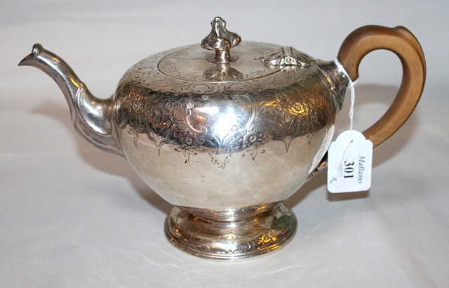 Appraisal: A WILLIAM IV SCOTTISH TEAPOT bullet shaped with engraved foliate