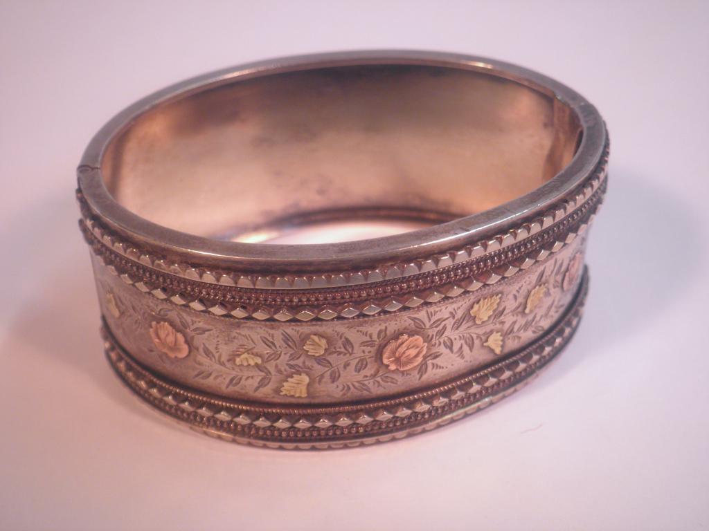 Appraisal: A late thC early thC stiff hinged white metal bangle