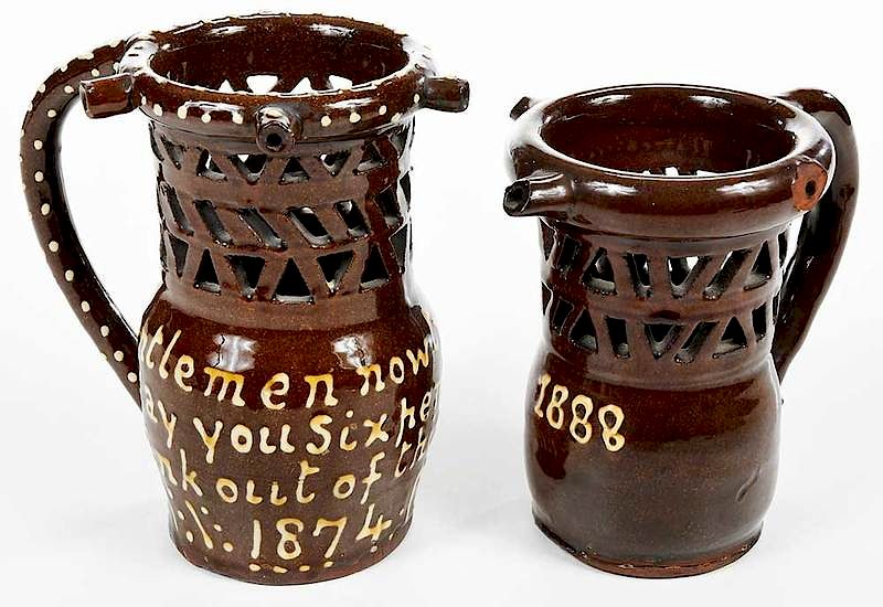 Appraisal: Two th Century Slip Glazed Puzzle Mugs British one with