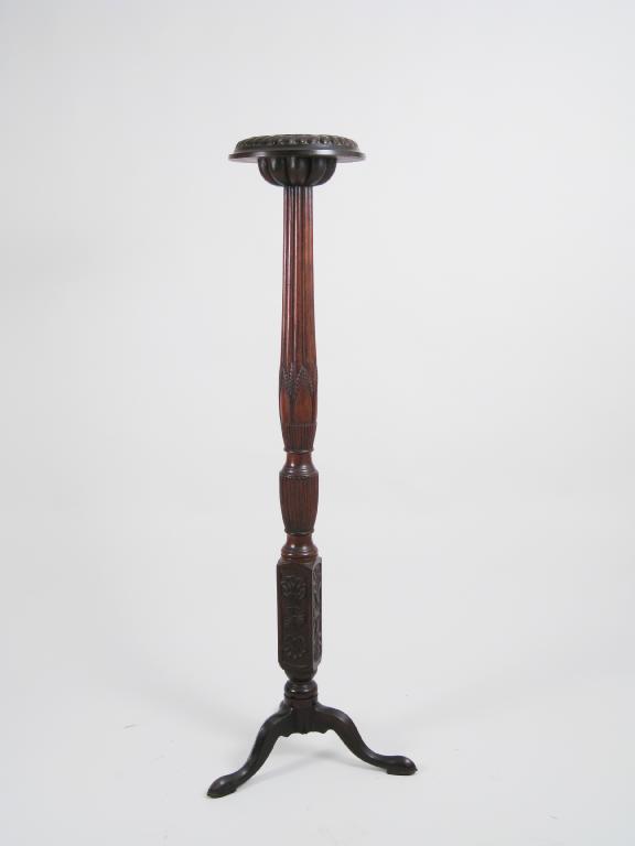 Appraisal: A mahogany Torchere with reeded carved column