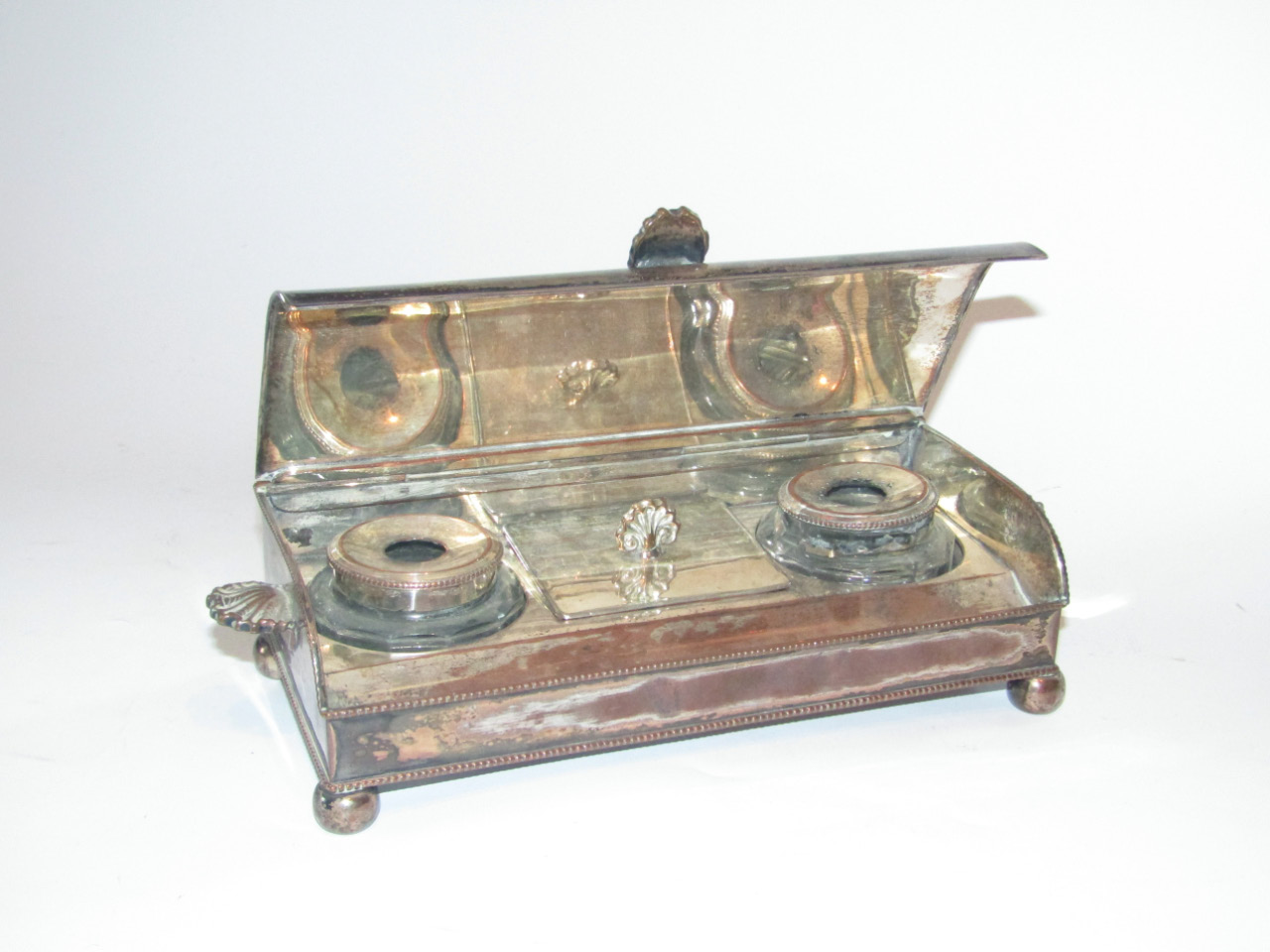 Appraisal: A Sheffield Plate desk stand of oblong shape with a