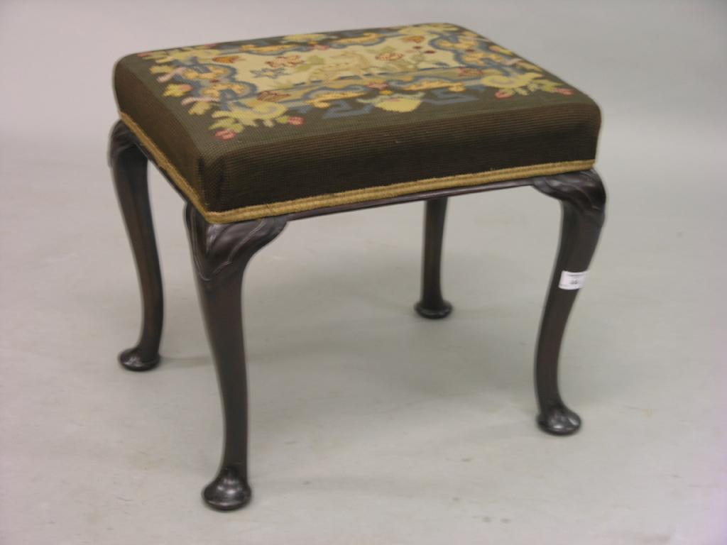 Appraisal: A Victorian mahogany stool with petit-point needlework seat on carved