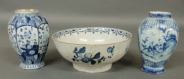 Appraisal: - Two similar Delft garnitures h and a Delft bowl