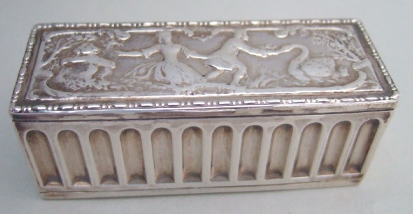 Appraisal: A silver hinge lidded rectangular hairpin box the lid decorated