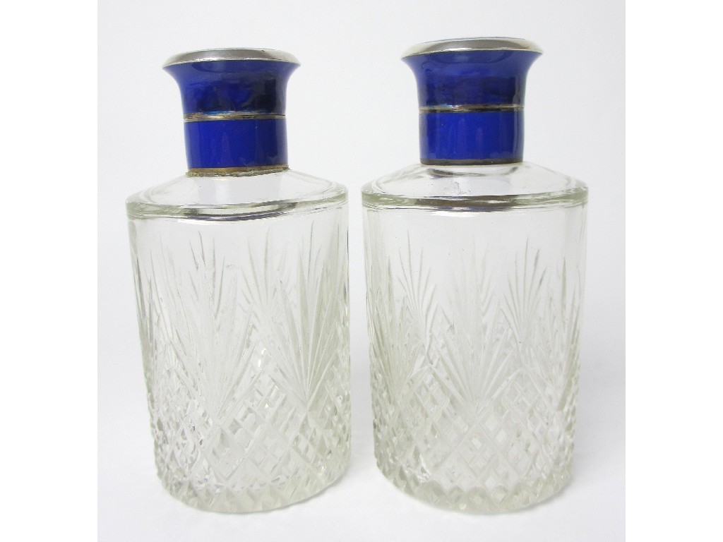 Appraisal: A pair of cut glass scent bottles the silver and