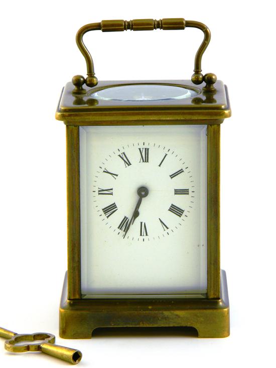 Appraisal: French Carriage clock brass with white face and Roman numerals