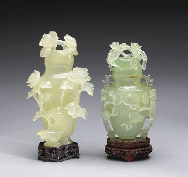 Appraisal: Two carved serpentine covered vases Each of baluster form emerging