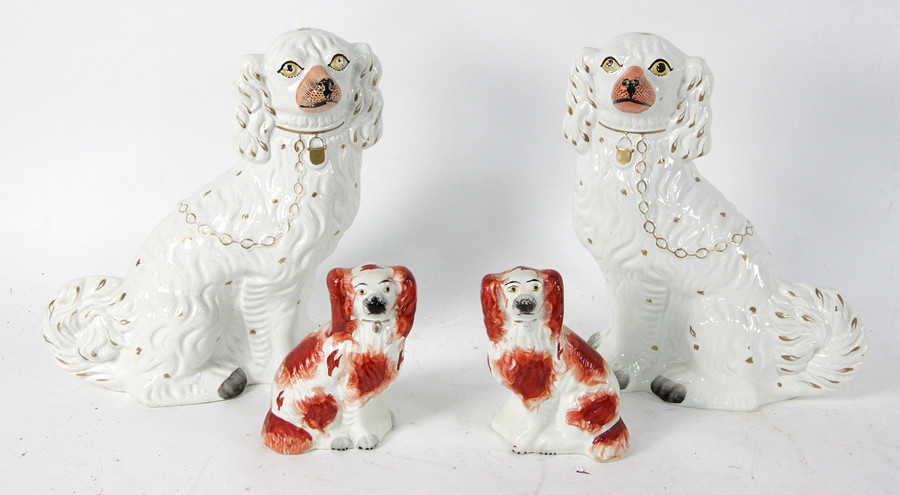 Appraisal: A pair of Staffordshire dogs with gilt collars and another