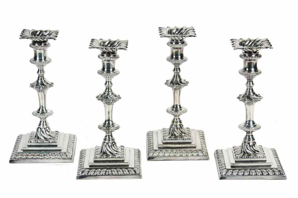 Appraisal: SET ENGLISH CANDLESTICKS - Four George III Style Square Based