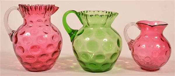 Appraisal: Three Colored Glass Coin Dot Pattern Pitchers Three Colored Glass