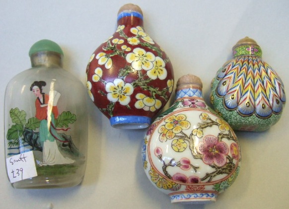 Appraisal: A group of four snuff bottles comprising a porcelain example