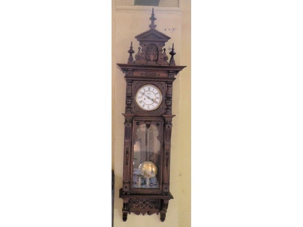 Appraisal: A late thC Vienna wall clock in a carved oak