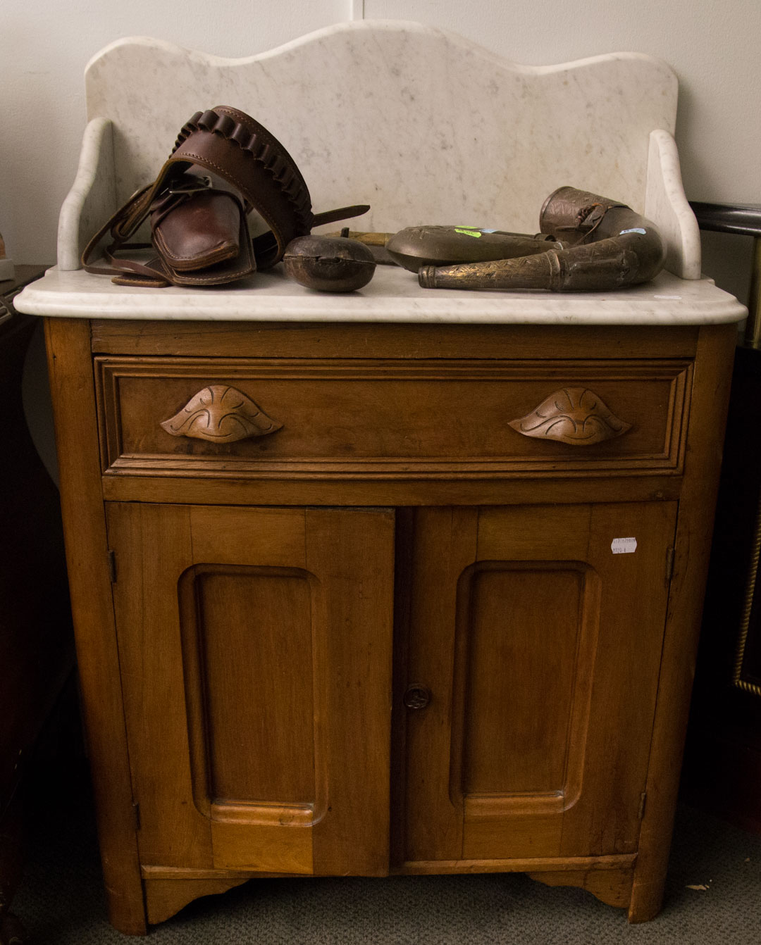 Appraisal: a Victorian walnut marble top washstand