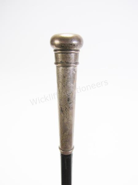 Appraisal: Hourglass Cane solid wood shaft with silver handle top of