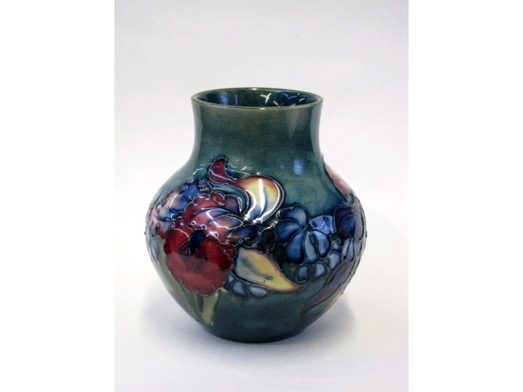 Appraisal: Moorcroft Orchid pattern globular shaped vase impressed and painted marks