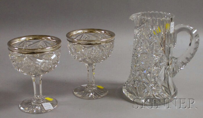 Appraisal: Three Decorative Colorless Cut Glass Table Items two silver-rimmed stemmed