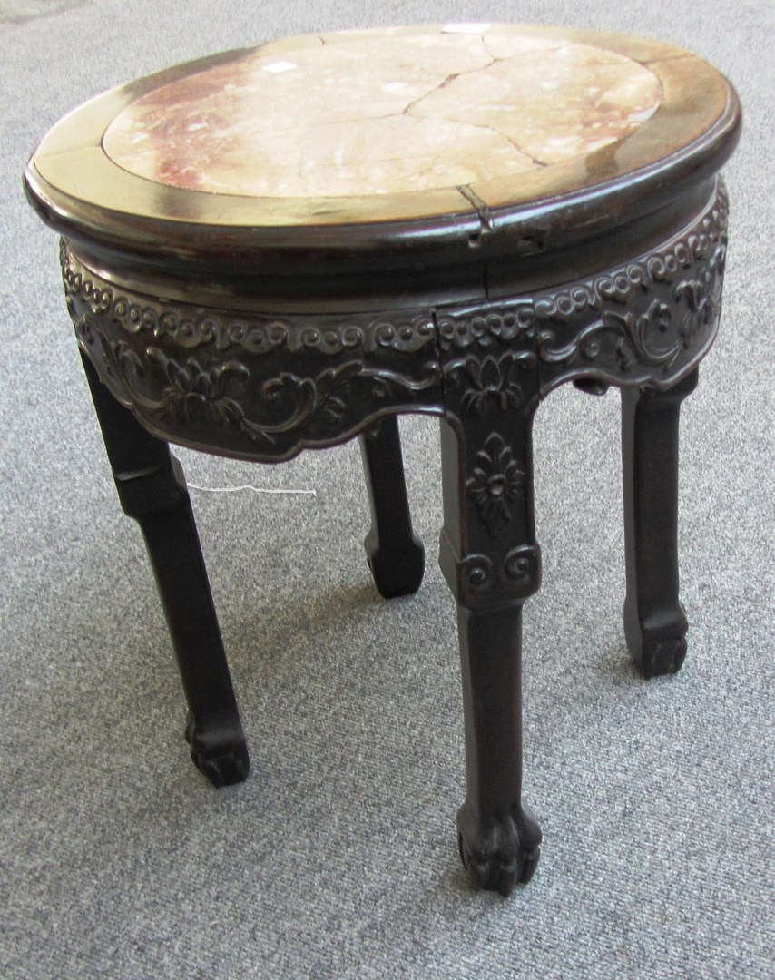 Appraisal: A late th century Chinese carved hardwood vase stand with