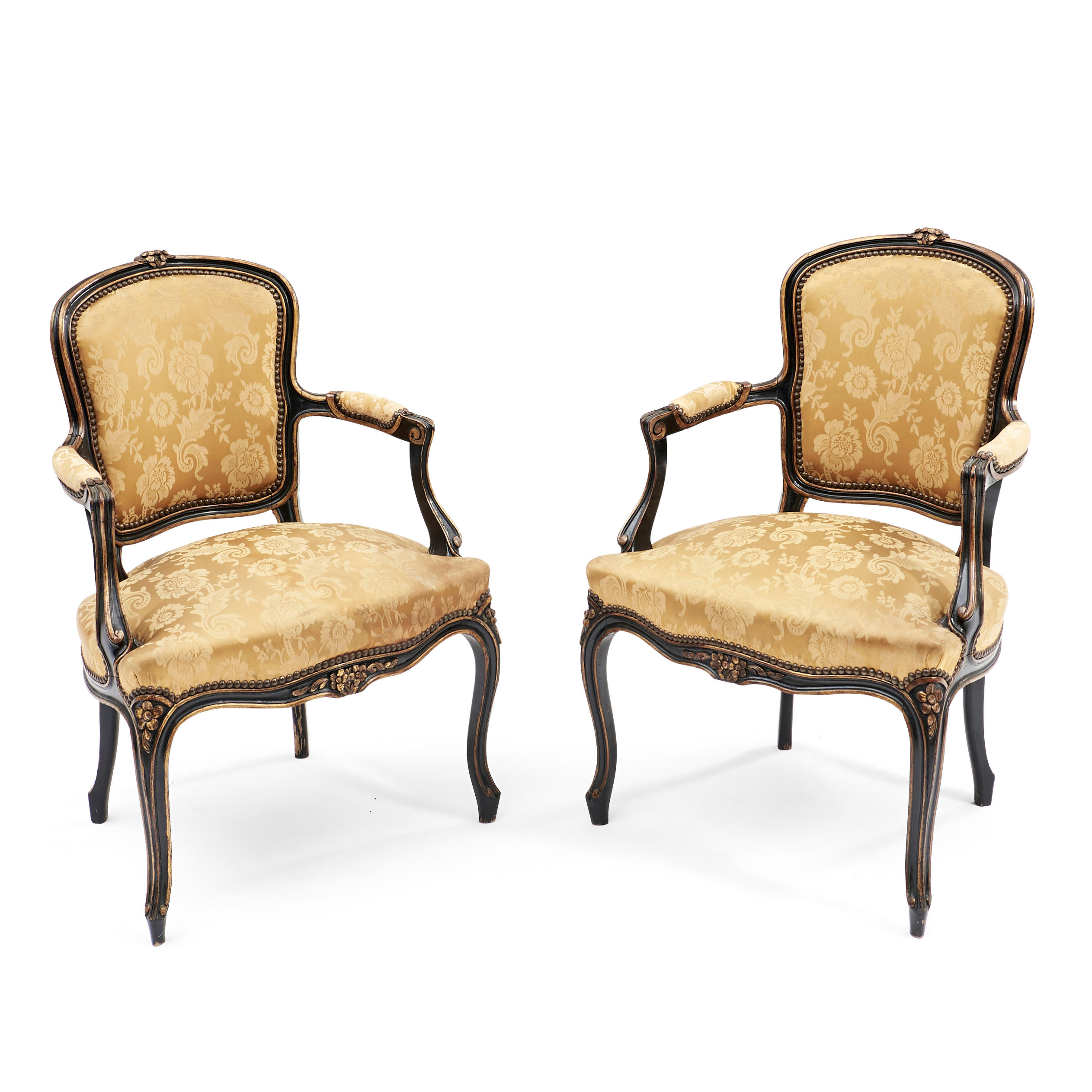 Appraisal: Pair of Louis XV-style Ebonized Fruitwood Upholstered Fauteuils with floral-carved