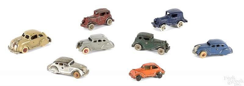 Appraisal: Eight small cast iron cars Eight small cast iron cars