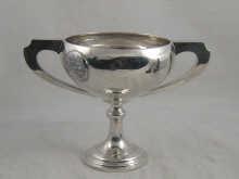 Appraisal: A silver two handled trophy cup with applied plaque of