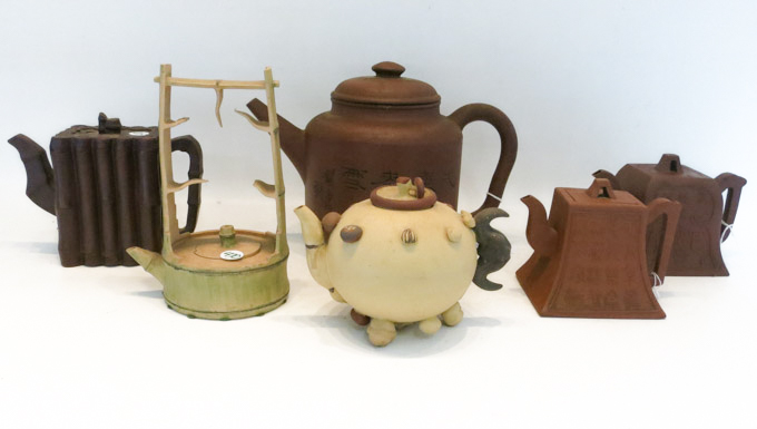 Appraisal: SIX ASIAN POTTERY TEAPOTS of various sizes and shapes and