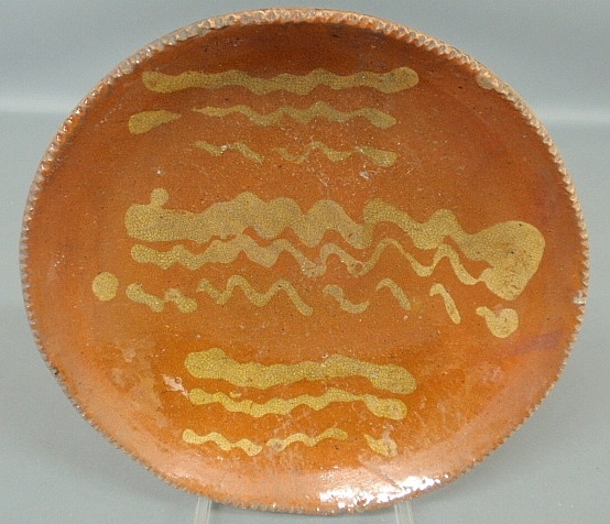 Appraisal: - Pennsylvania redware plate th c with yellow slip decoration