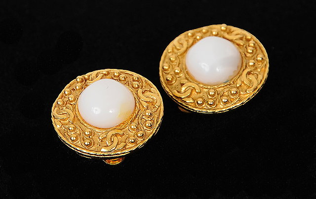 Appraisal: A pair of gilt metal clip on Chanel earrings circular