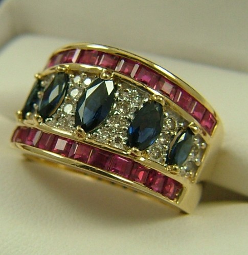 Appraisal: RUBY SAPPHIRE DIAMOND AND FOURTEEN KARAT GOLD RING set with