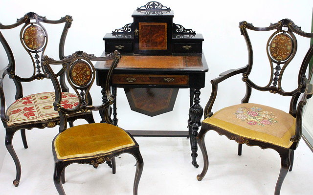 Appraisal: A PAIR OF EBONISED LINE INLAID ELBOW CHAIRS AND ONE