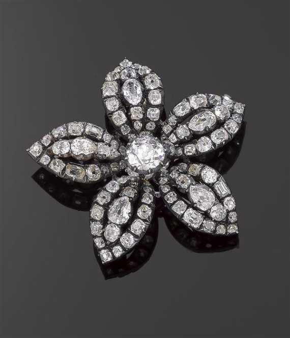 Appraisal: DIAMOND BROOCH ca Silver Fancy flower-shaped brooch the centre set