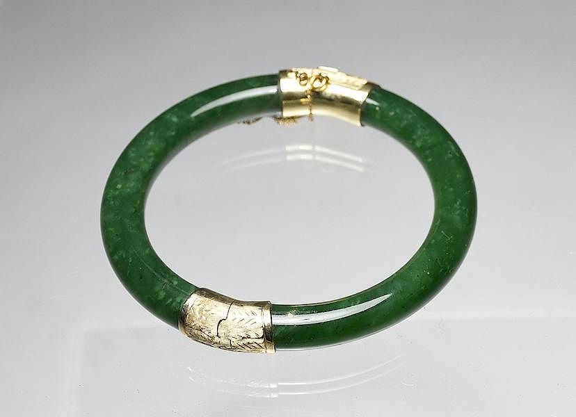 Appraisal: Good spinach green jade bangle bracelet Good spinach green jade